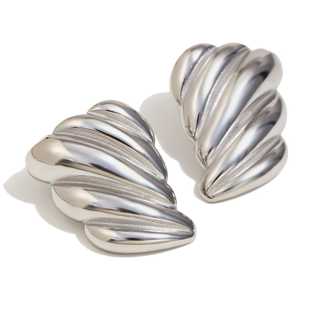 A pair of silver stainless steel earrings with a sculpted, wave-like design.