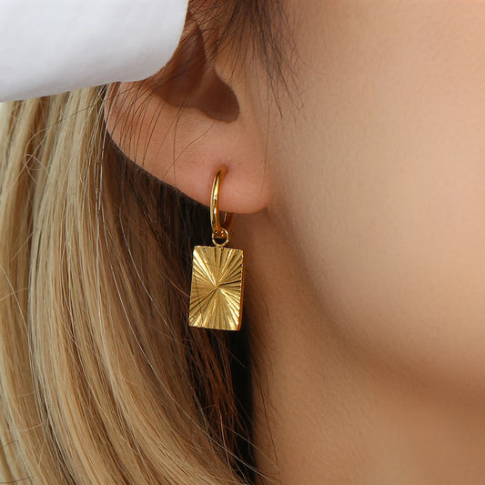 Inner Light Earrings rectangle on model