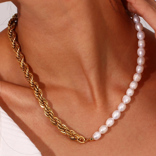 Gold chain and pearl necklace on a person's neck