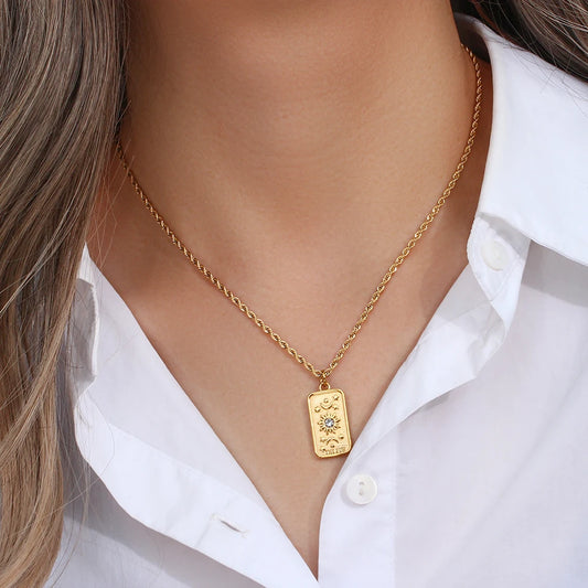 Stainless steel gold necklace featuring tarot card pendant, displayed on a model's neck