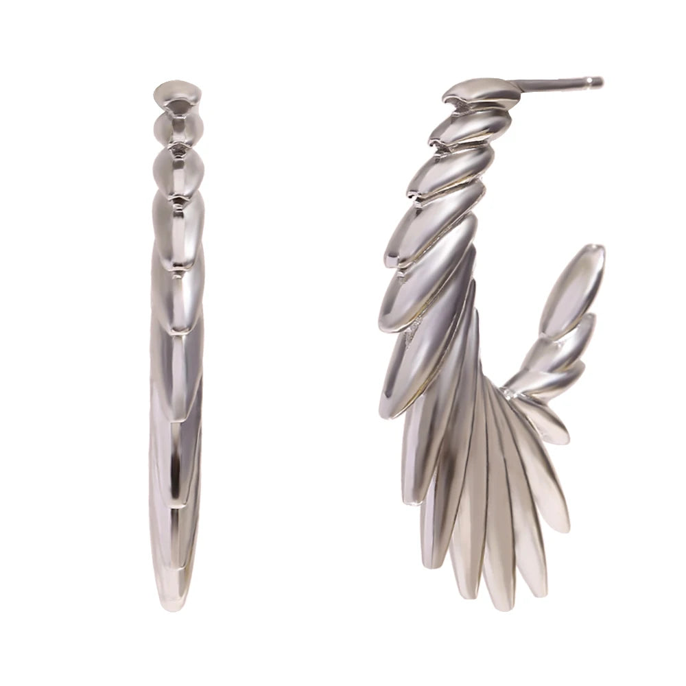 A pair of stainless steel hoop earrings with a textured and spiky design.