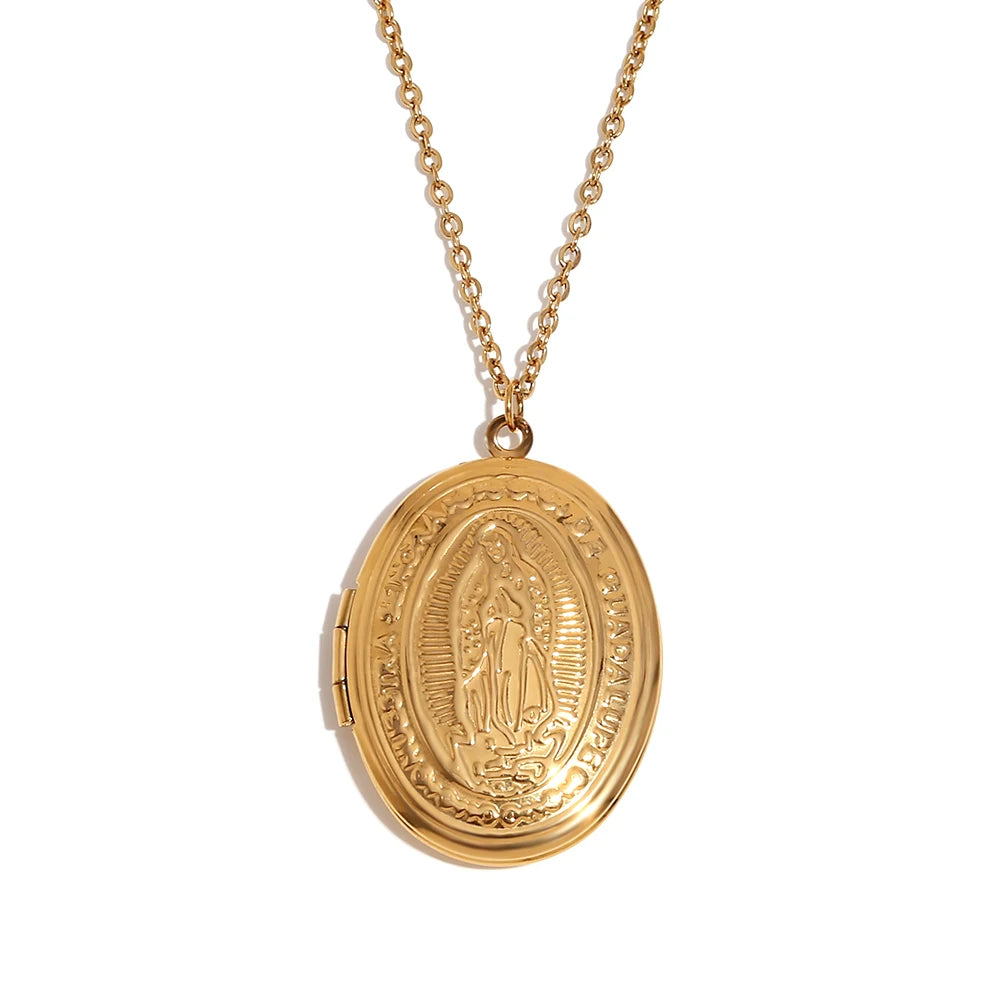 An oval-shaped gold-plated locket necklace with vintage-inspired engravings, attached to a gold chain