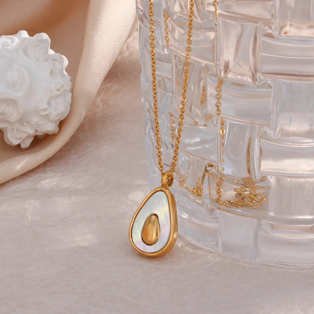 Aguacati Glow Necklace on glass