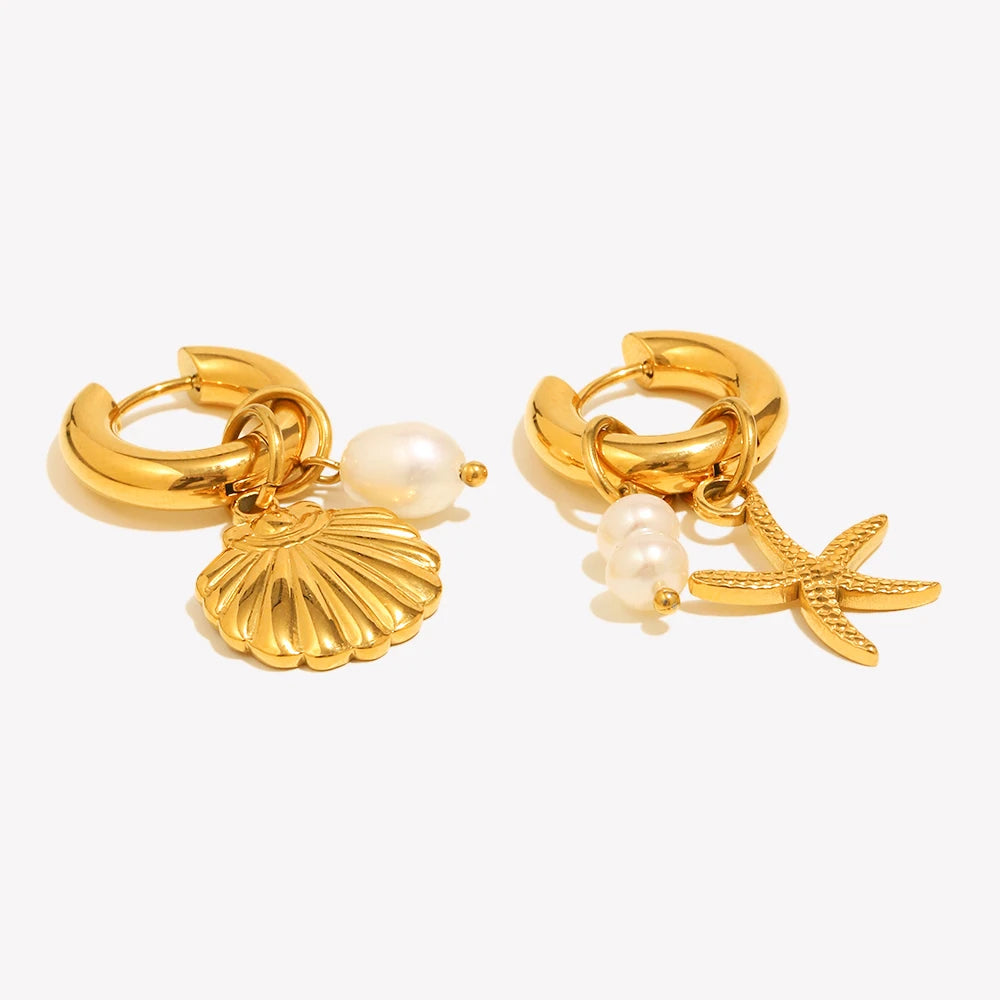 Gold hoop earrings with shell and starfish charms on a white background