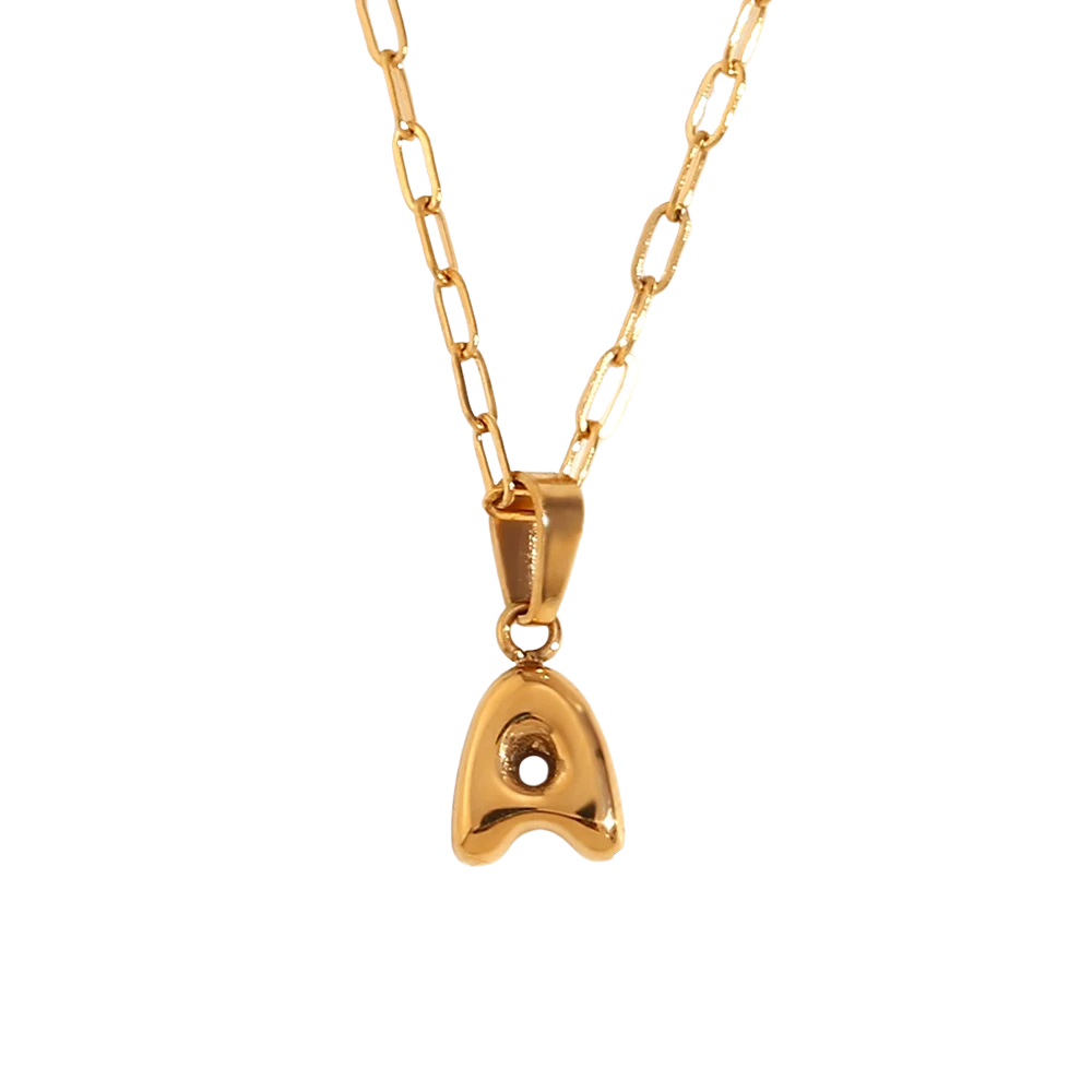 Gold necklace with a letter A pendant on a white background