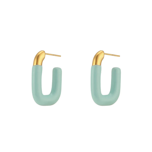 A pair of gold-colored hoop earrings with a pastel blue coating.