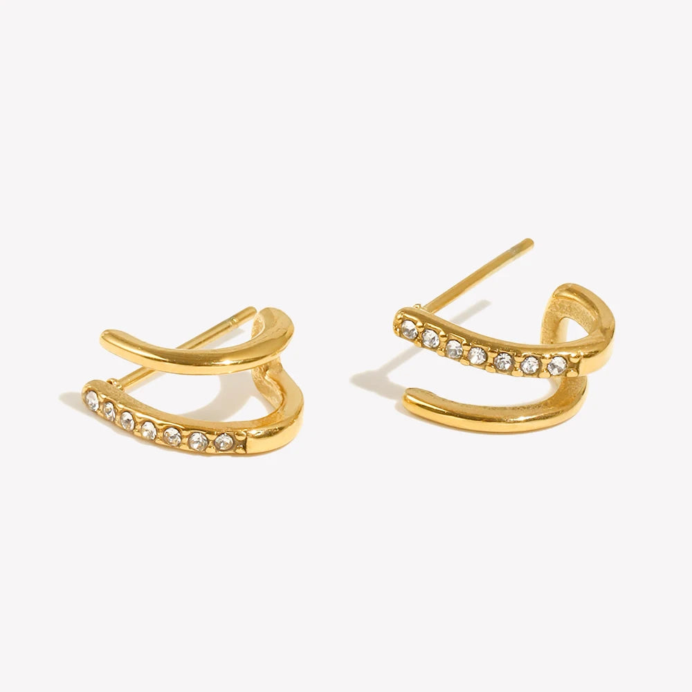 small Gold earrings with small stones on a white background