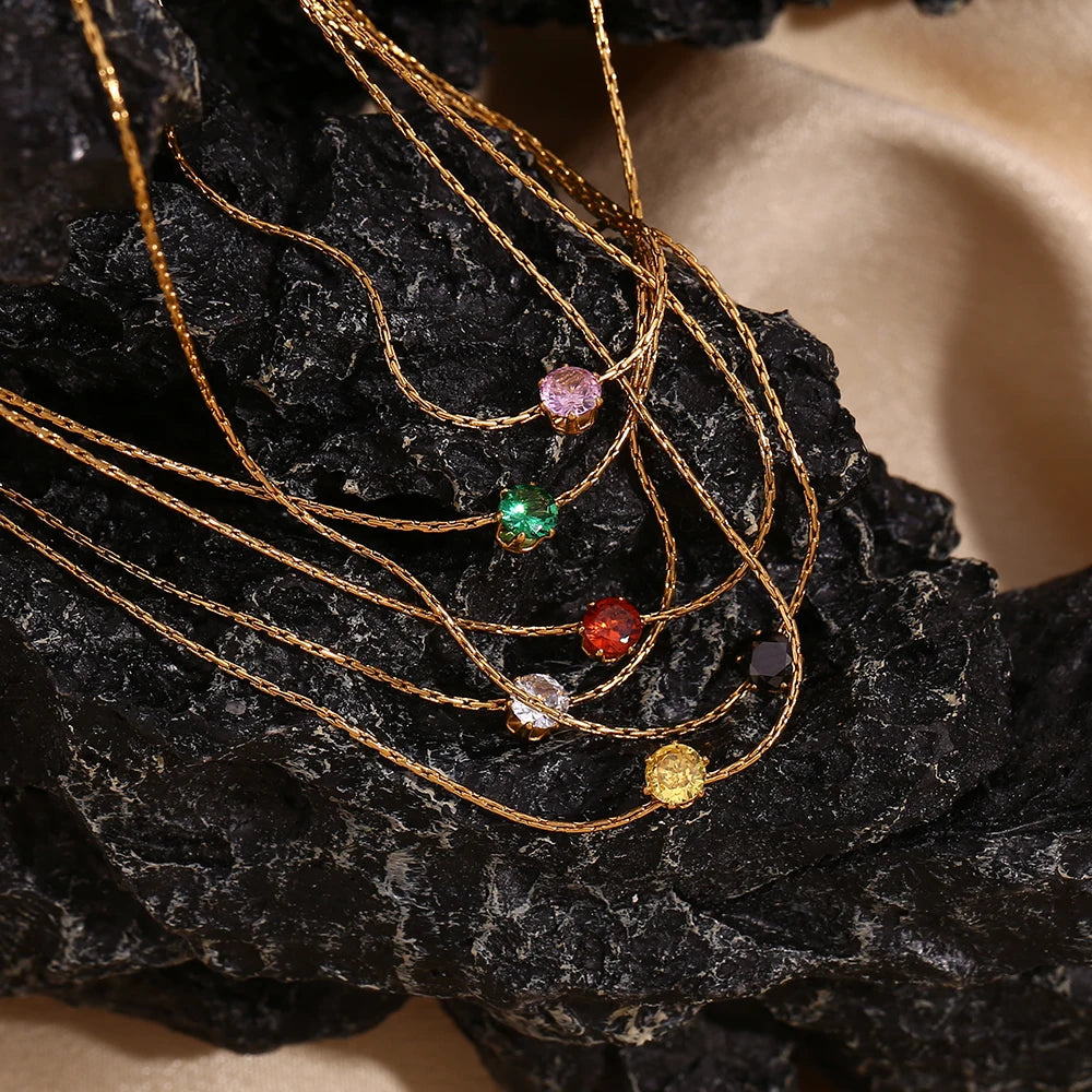 Delicate Dot Necklaces on stone