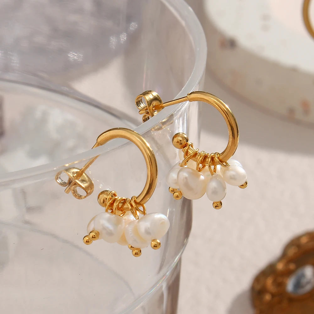 dewdrops hoop earrings display on glass
