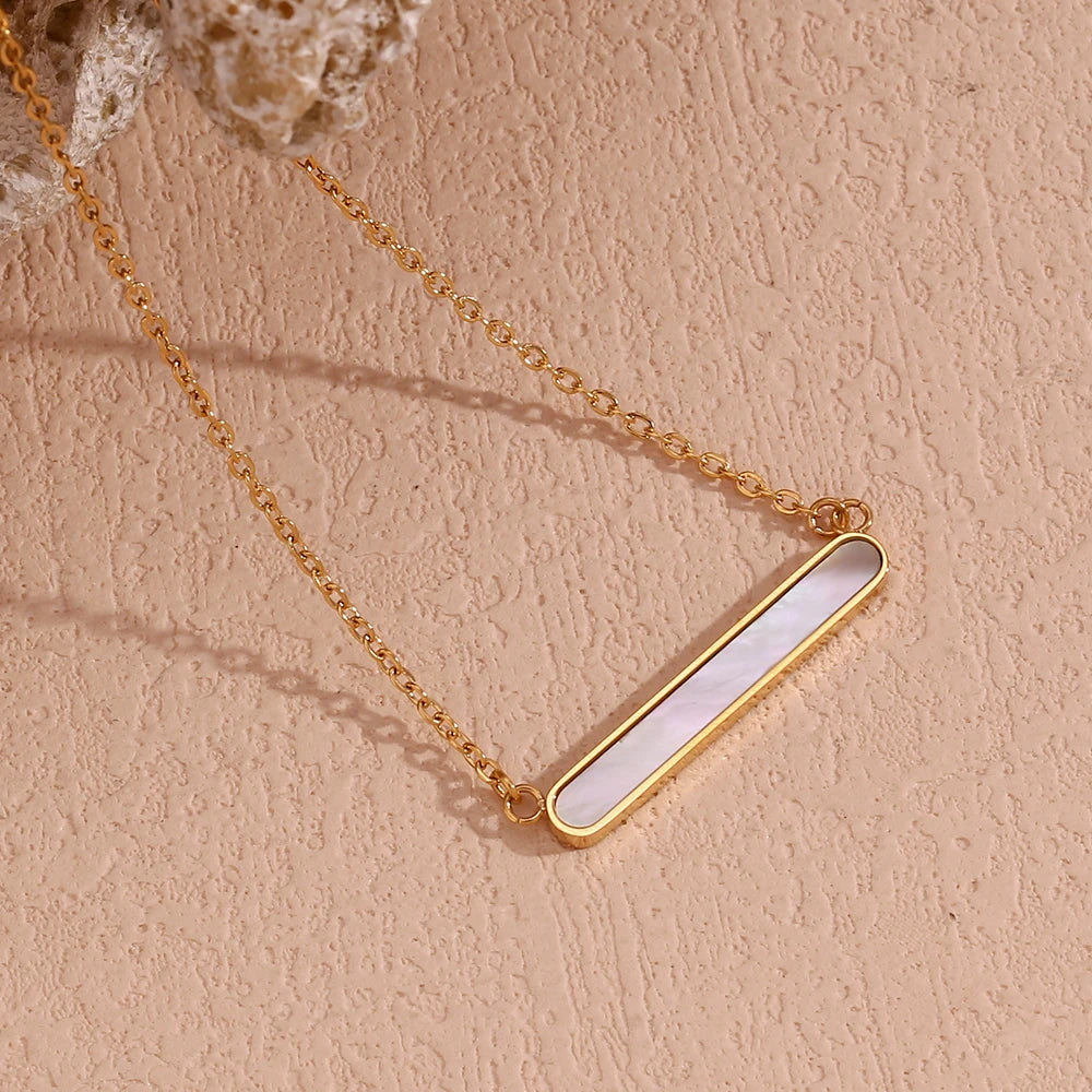 A gold-plated stainless steel necklace with a rounded bar pendant, simple and elegant in design.