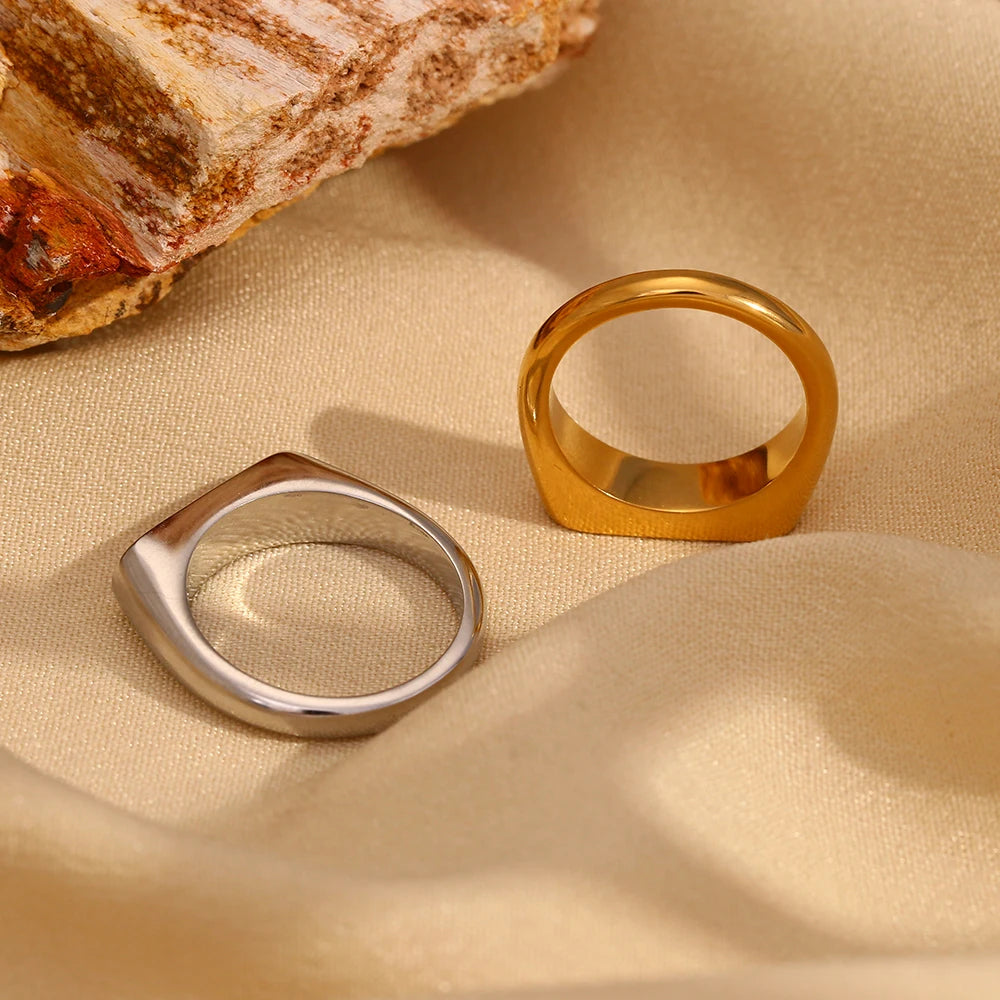 stainless steel signet rings with the word 'you can' engraved on the top, captured from the back side