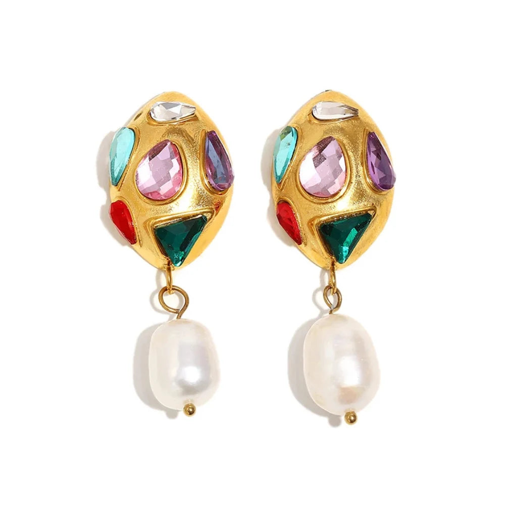Colorful gemstone earrings with pearl drops on a white background
