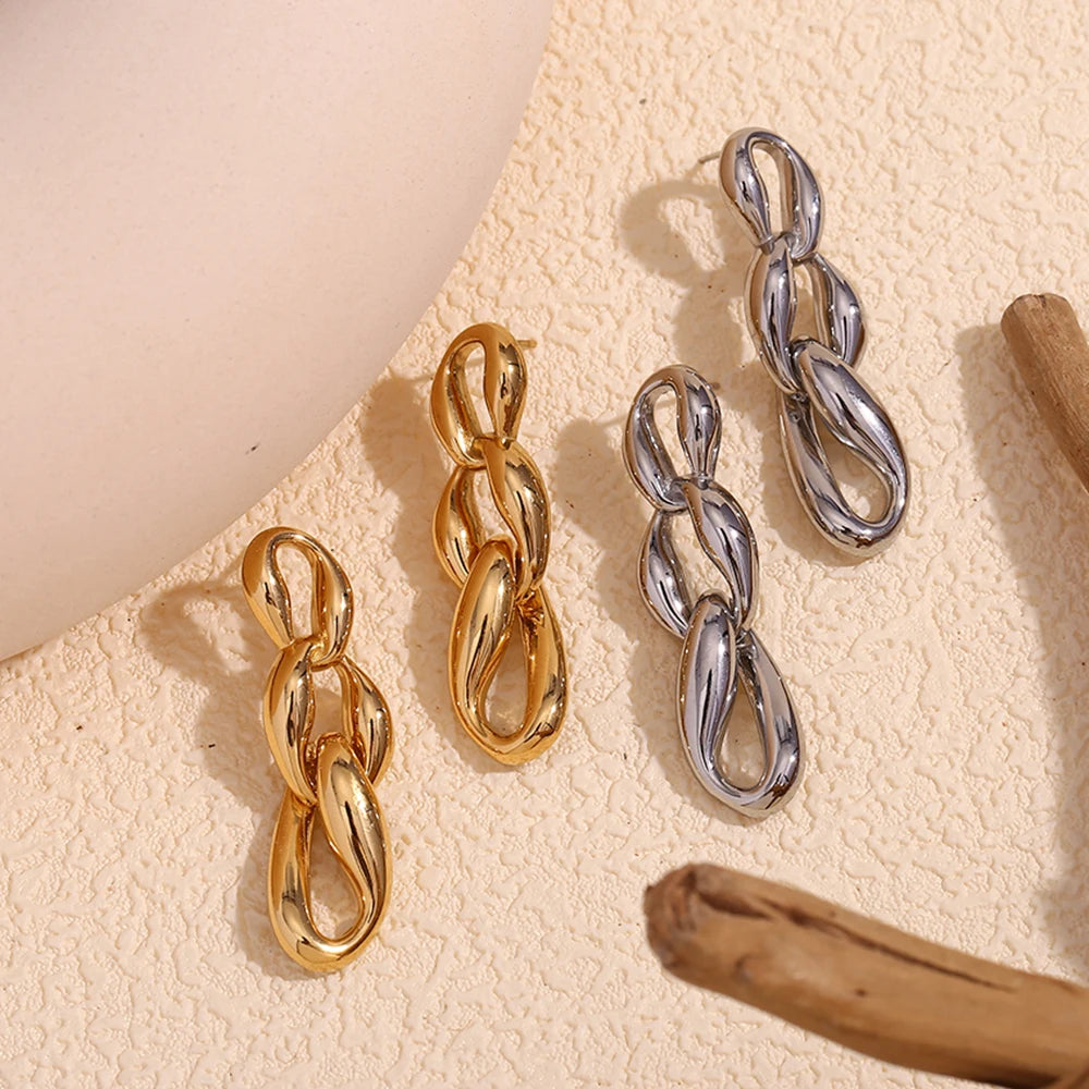 Glamlinks Earrings in silver and gold flat lay