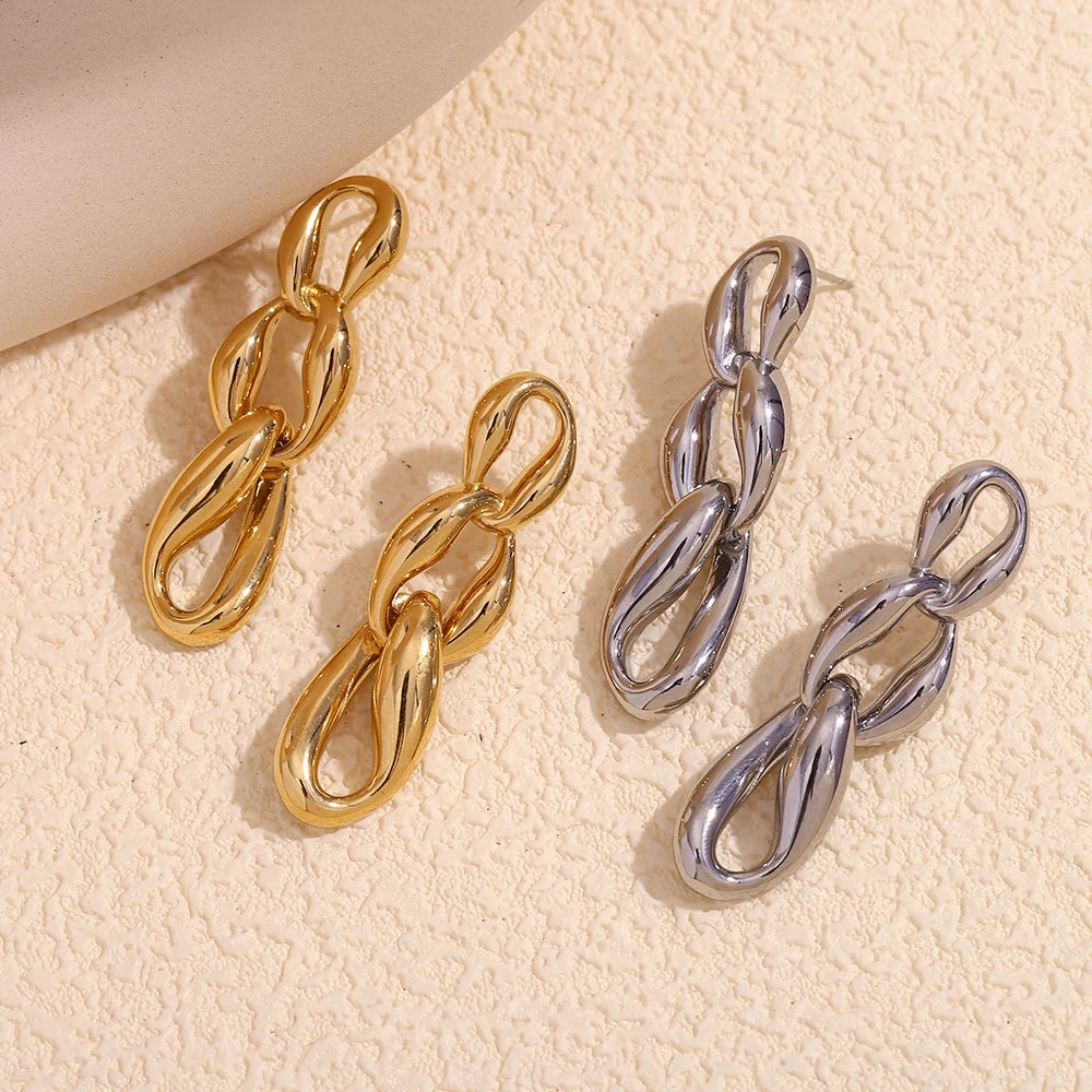 Glamlinks Earrings Flat Lay in silver and Gold