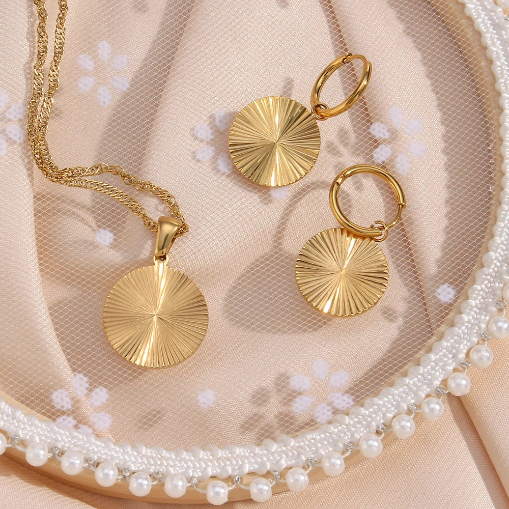 Inner Light Earrings and necklace circle flat lay