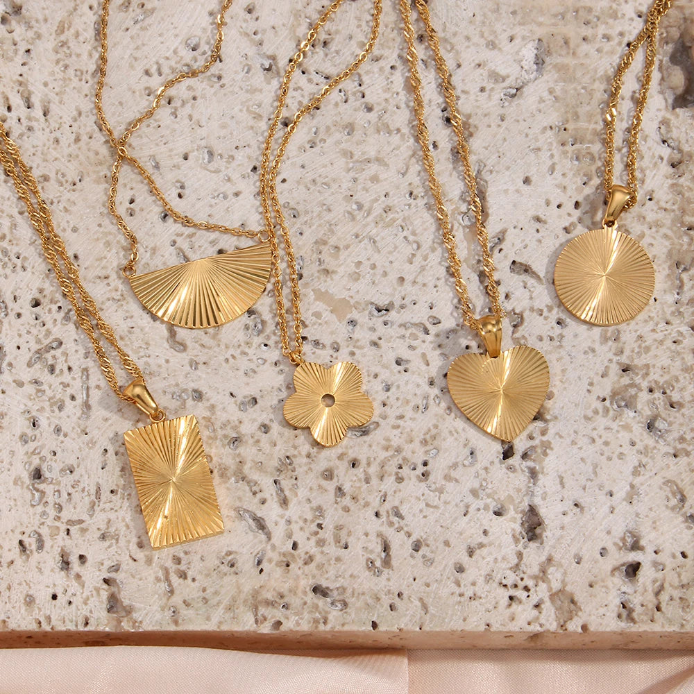 Inner Light Necklaces on stone display