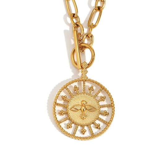 A gold-plated necklace with a chunky modern chain and a bold pendant featuring a design that symbolizes freedom and strength.