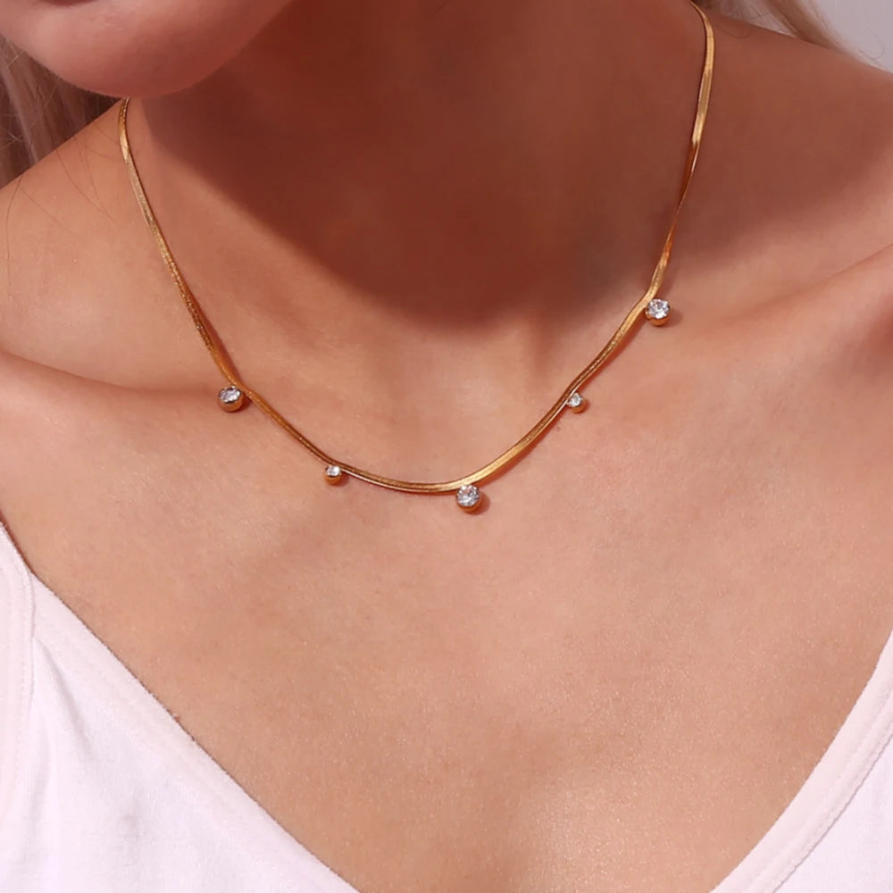 A 18K gold-plated stainless steel necklace with round zirconia crystals on model