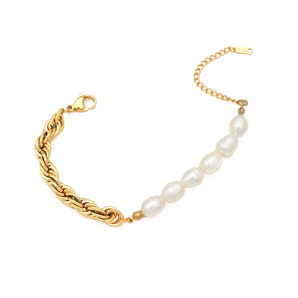 Gold chain bracelet with natural pearls on a white background