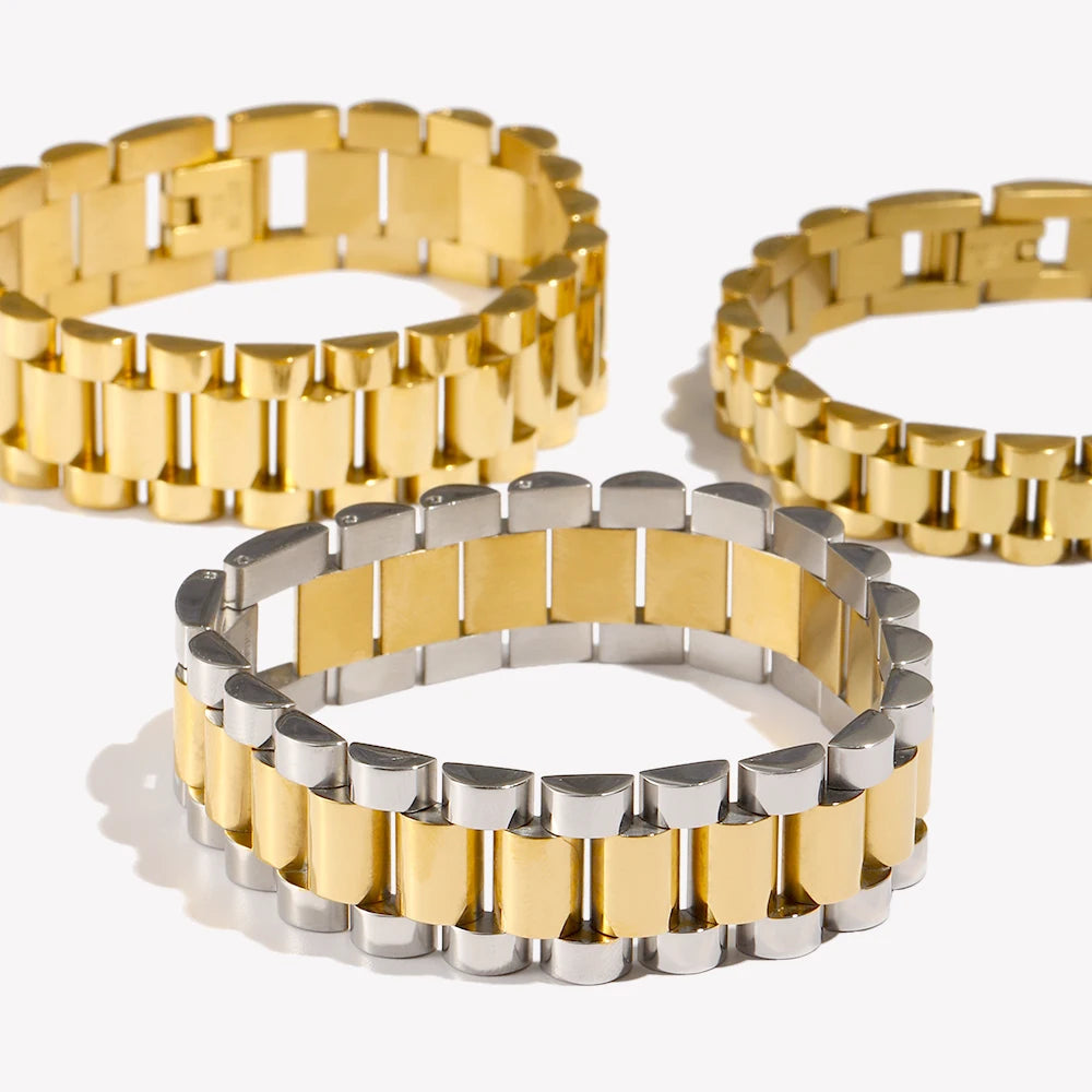 two heavy gold president bracelets and one silver and gold link bracelet on a white background
