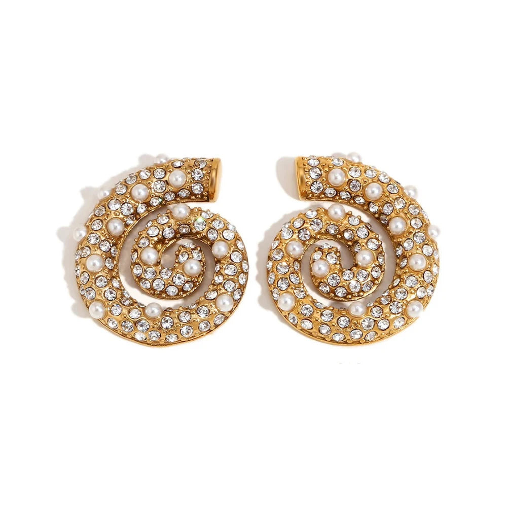 A pair of spiral design earrings adorned with pearls and zirconias, set in gold-plated metal.
