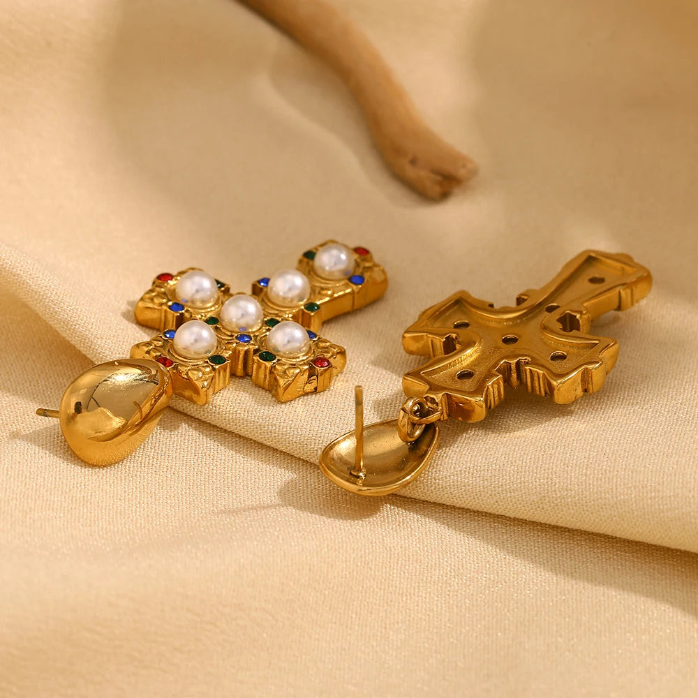 A pair of gold-plated earrings in the shape of a cross, adorned with multicolored zirconia and pearls back side view