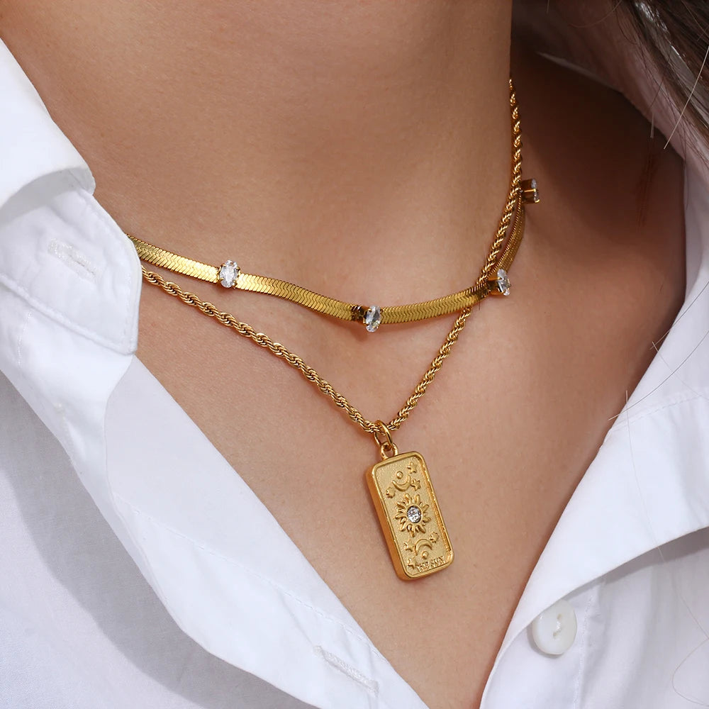 Stainless steel gold necklace featuring tarot card pendant, displayed on a model's neck