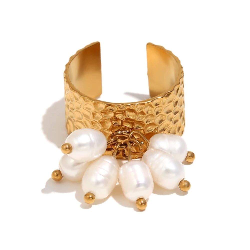 An 18K gold plated stainless steel ring with natural pearl embellishments, featuring a textured design and an adjustable band.