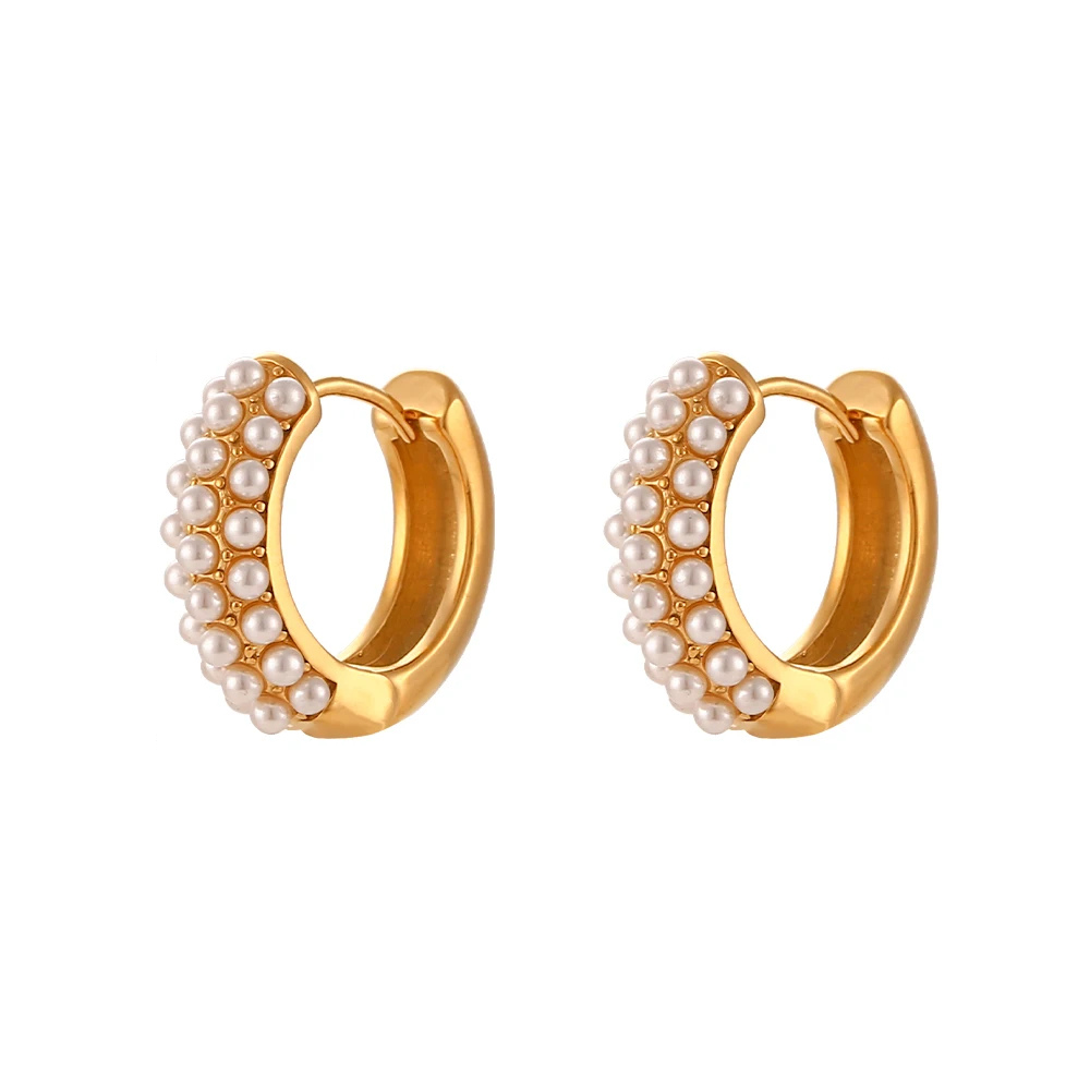 Gold hoop earrings with pearl accents on a white background