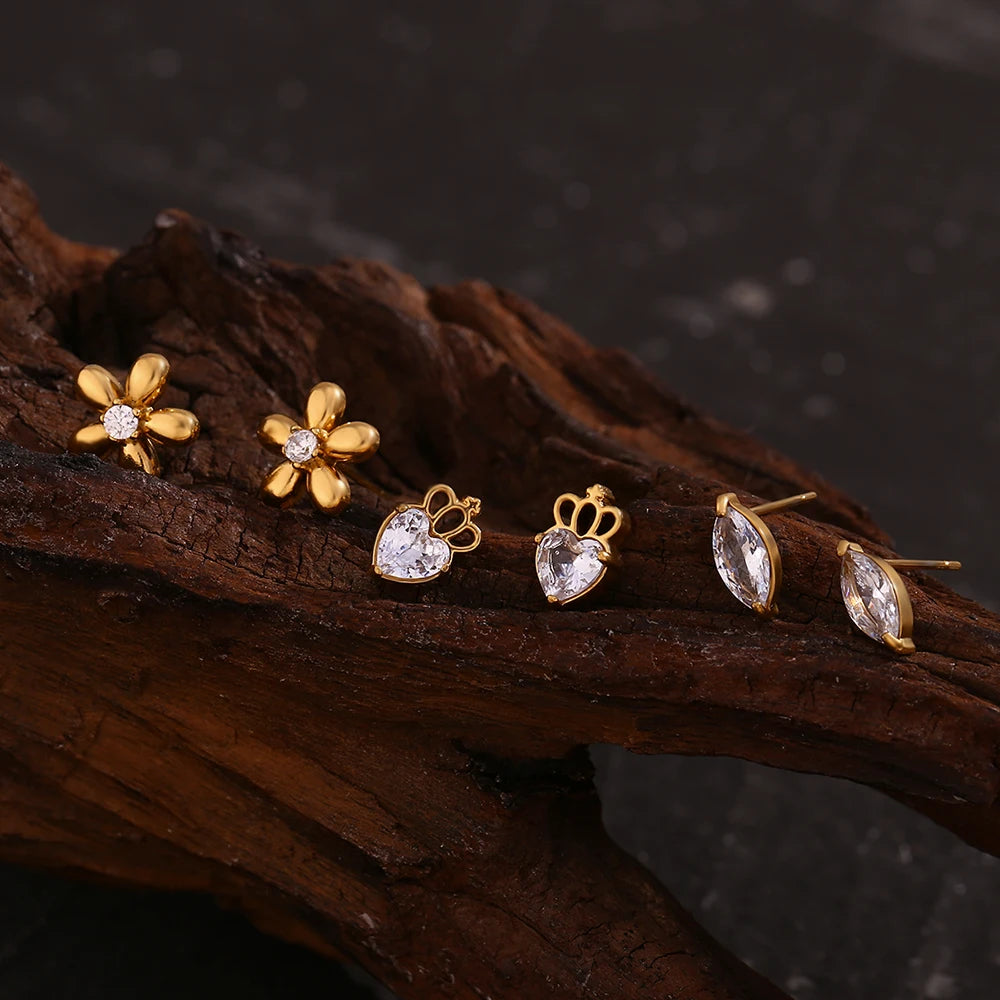 Petite Fleur Stud Earrings on wooden display