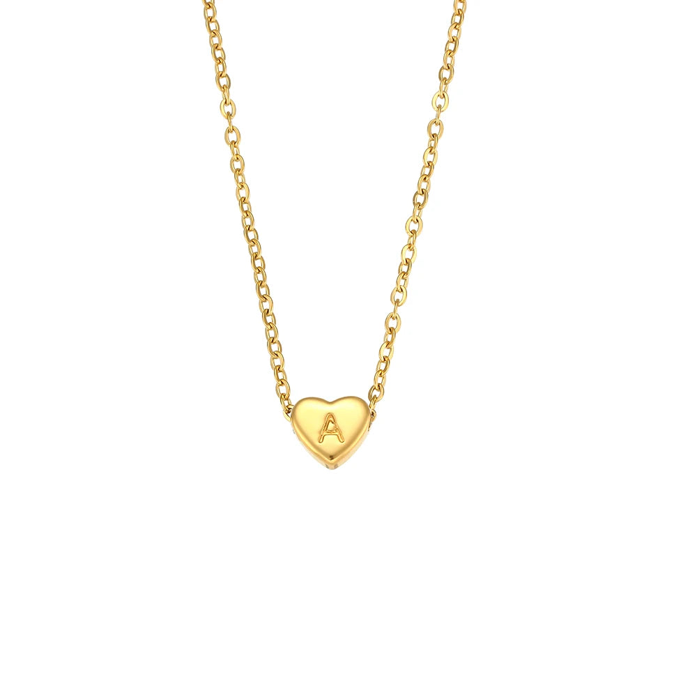 Gold necklace with a heart-shaped pendant featuring the letter 'A' on a white background