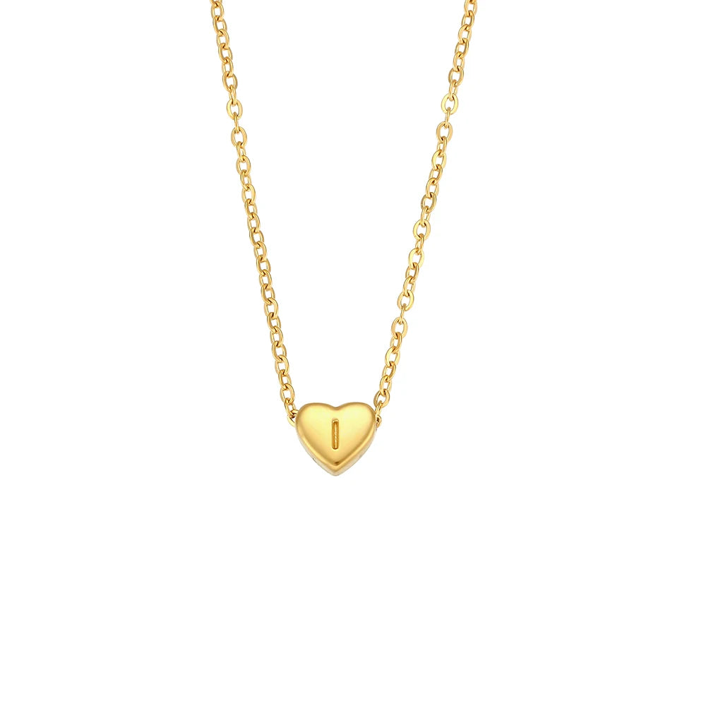 Gold necklace with a heart-shaped pendant on a white background