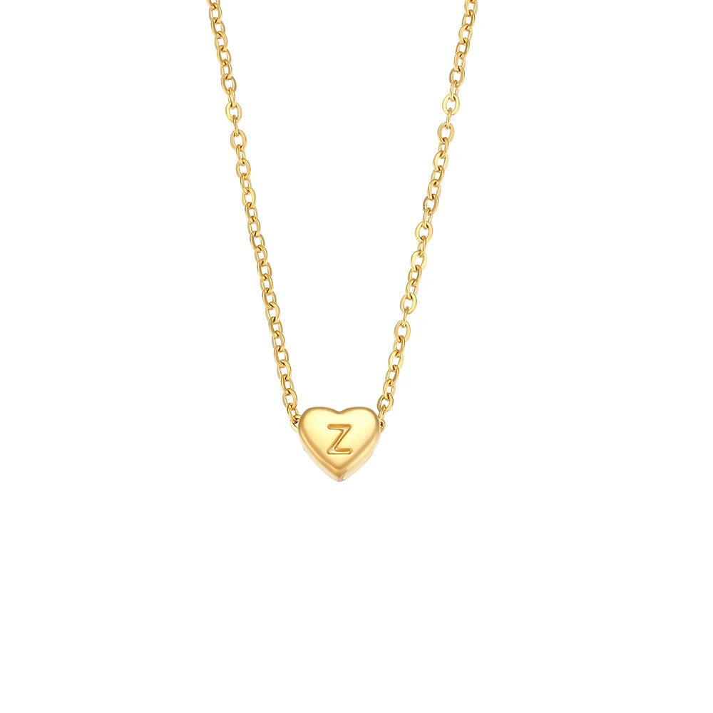 Gold necklace with a heart-shaped pendant featuring the letter 'Z' on a white background