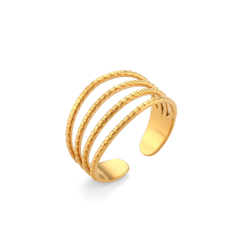 A gold-coated stainless steel ring with four bands that are merging into one, set against a white background.