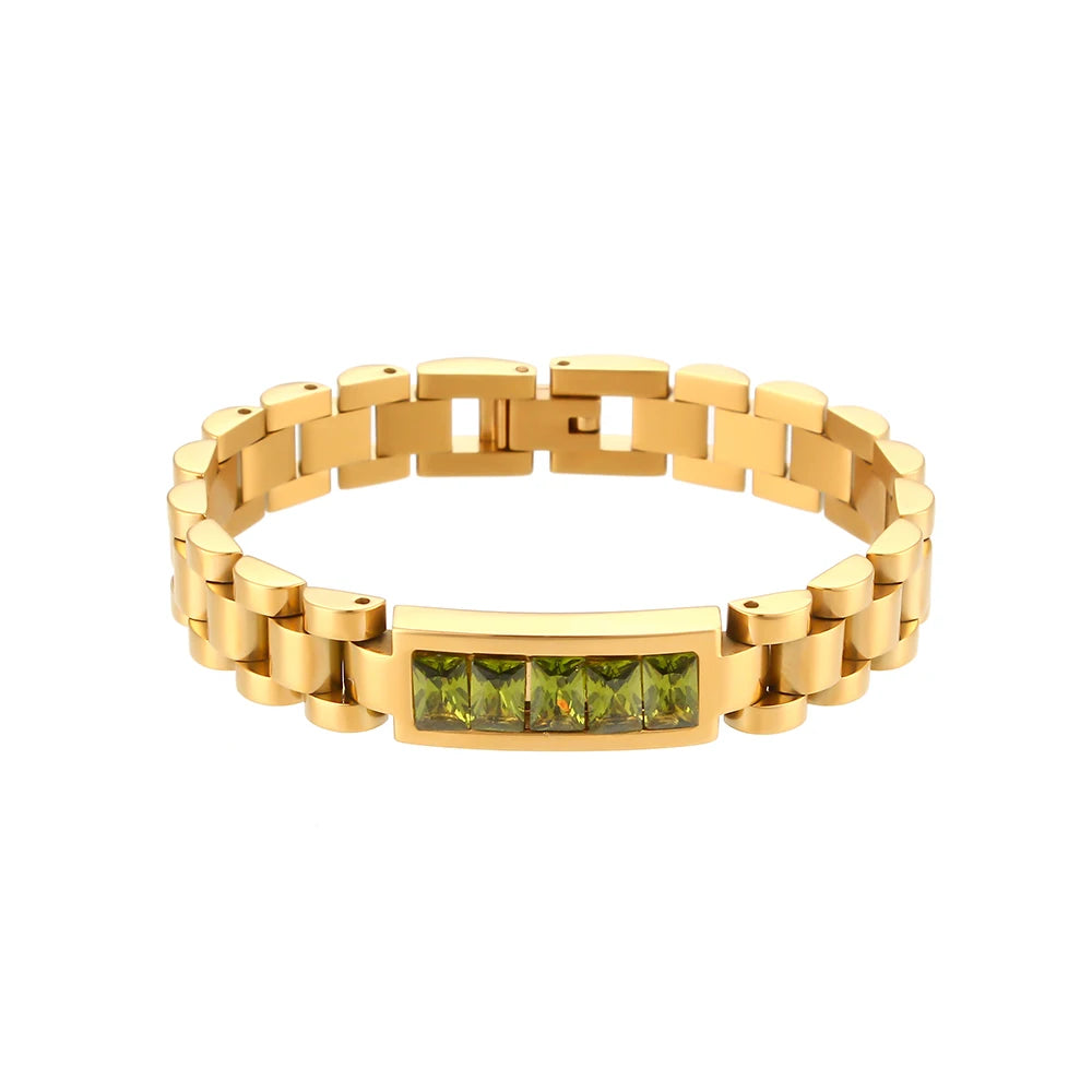 Gold steel bracelet with a green gemstone on a white background