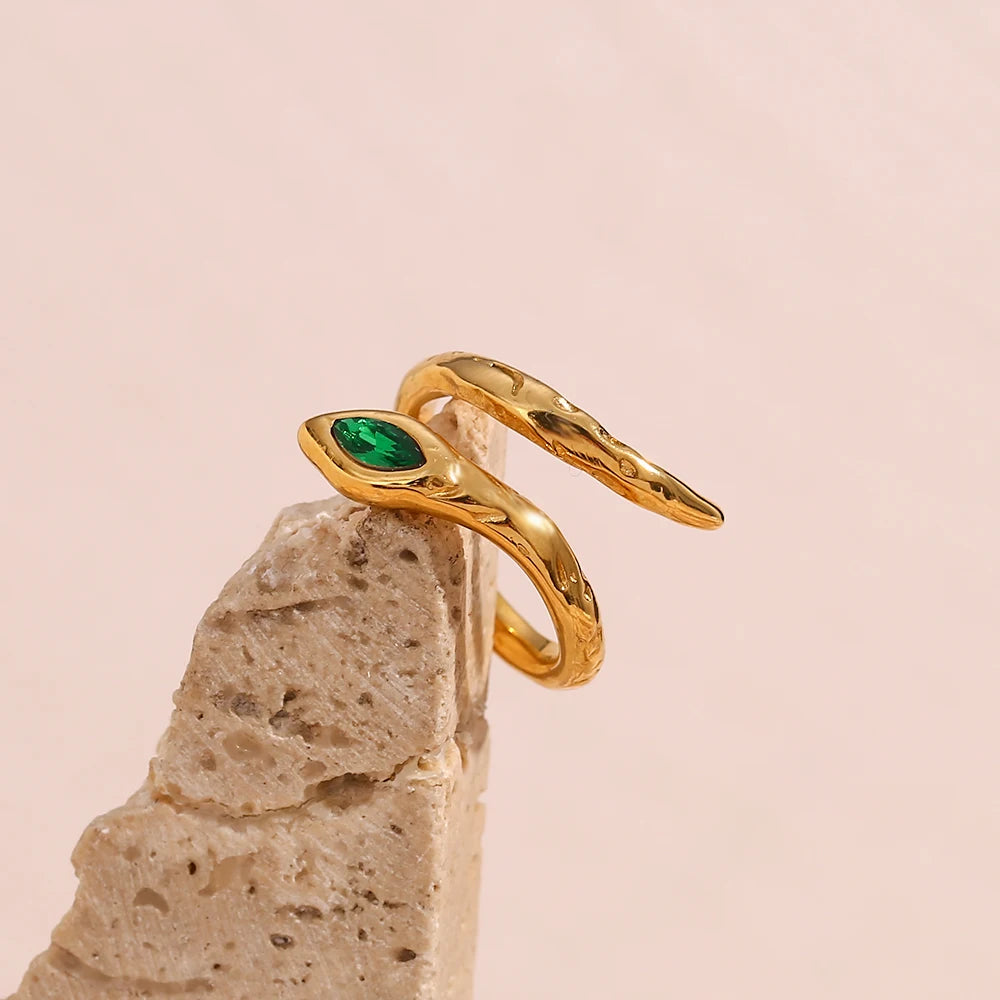 An 18K gold plated stainless steel ring in the shape of a snake with a AAA zirconia crystal on the head