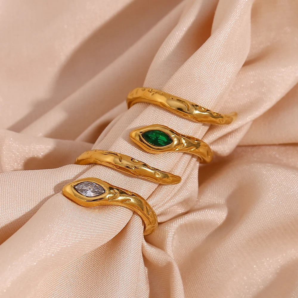An 18K gold plated stainless steel ring in the shape of a snake with a AAA zirconia crystal on the head