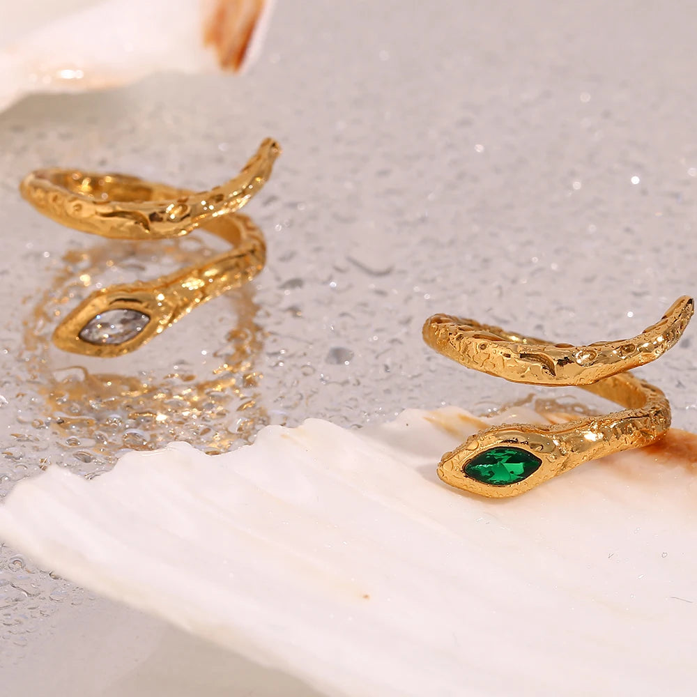 An 18K gold plated stainless steel ring in the shape of a snake with a AAA zirconia crystal on the head