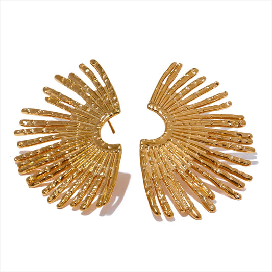 Solar Muse Earrings in gold on white background