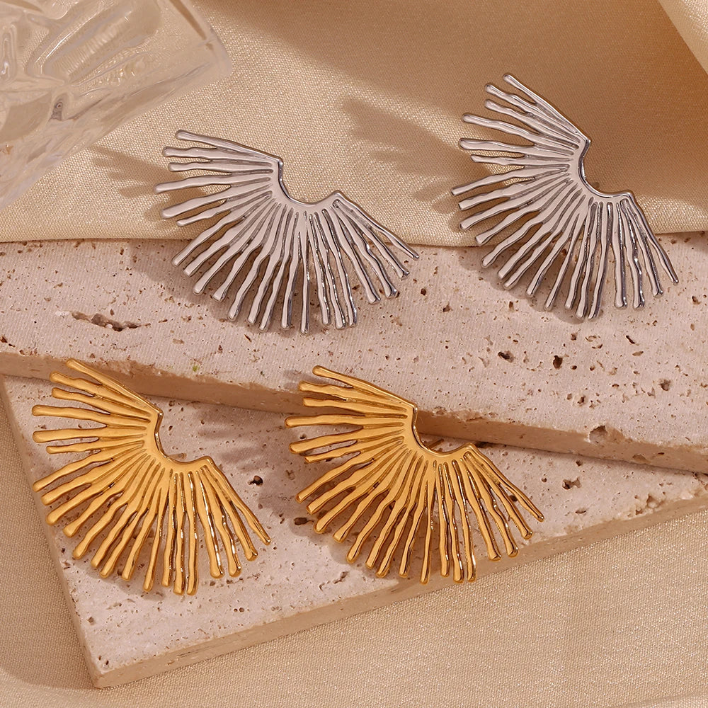 Solar Muse Earrings on stone display