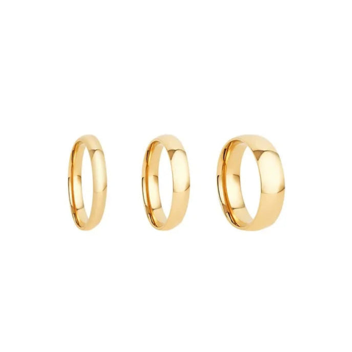 Three gold rings of different sizes on a white background