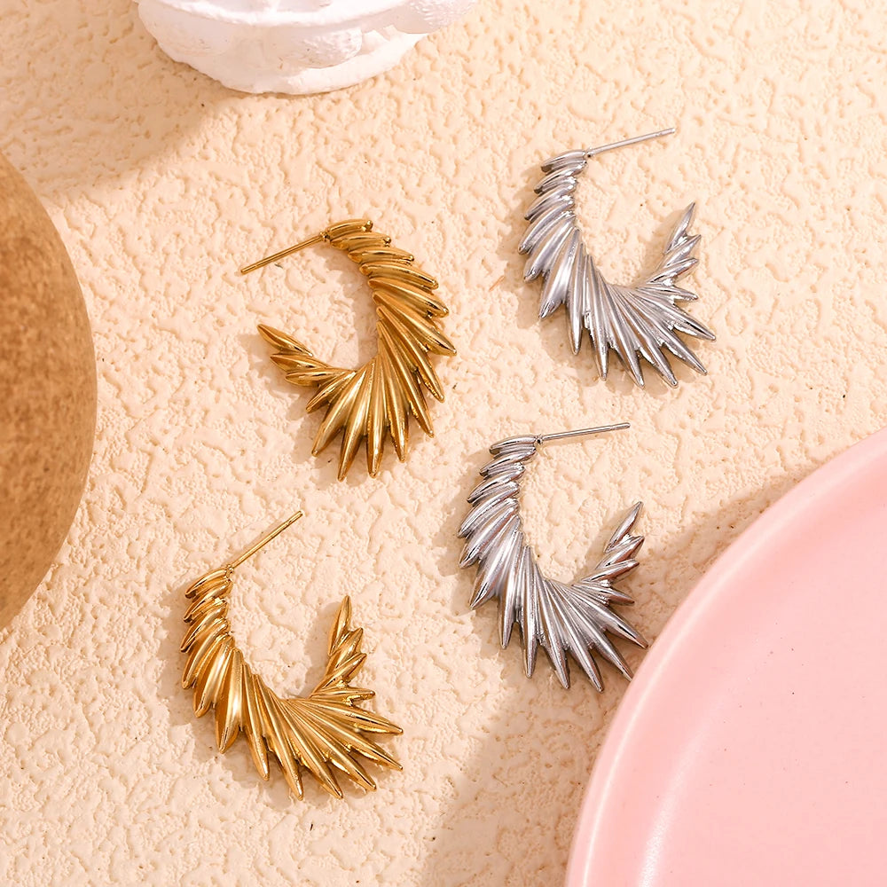 A pair of 18K gold plated stainless steel hoop earrings with a textured and spiky design.