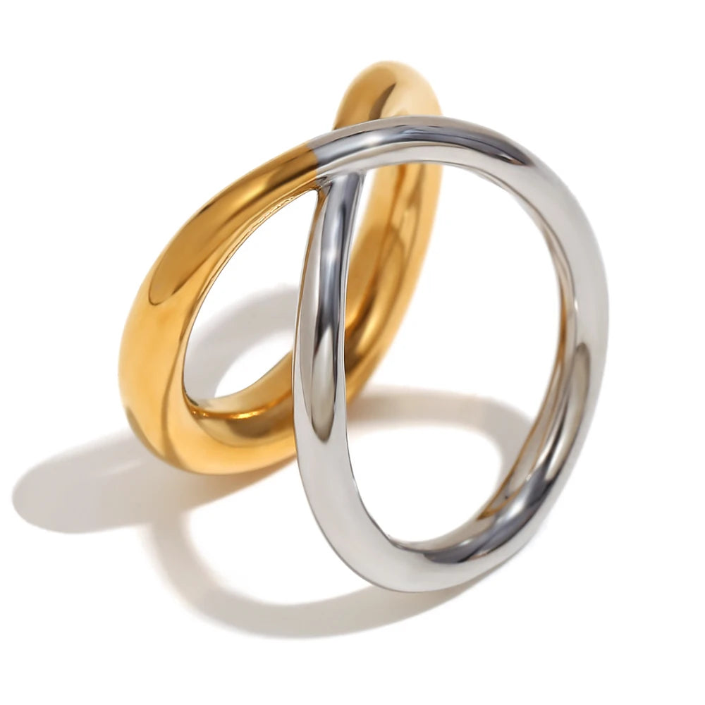 Elegant gold and silver mixed, double looped ring with a smooth finish.