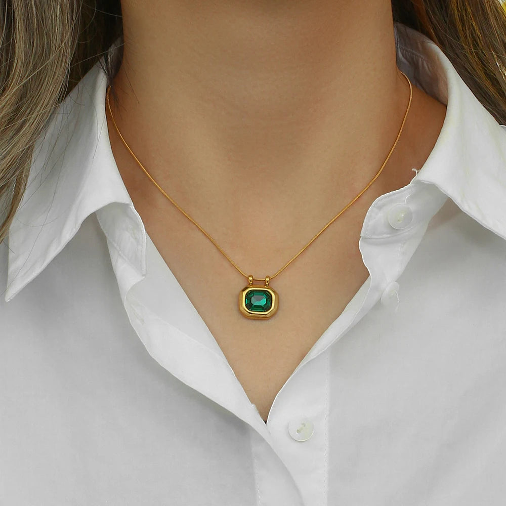 A gold-plated stainless steel necklaceswith a square-shaped AAA zirconia pendant, displayed on a model's neck