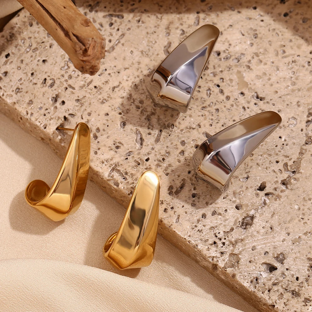 Spotlight Lover Earrings on stone tile