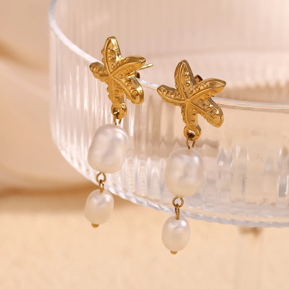 Star of The Sea Earrings on glass