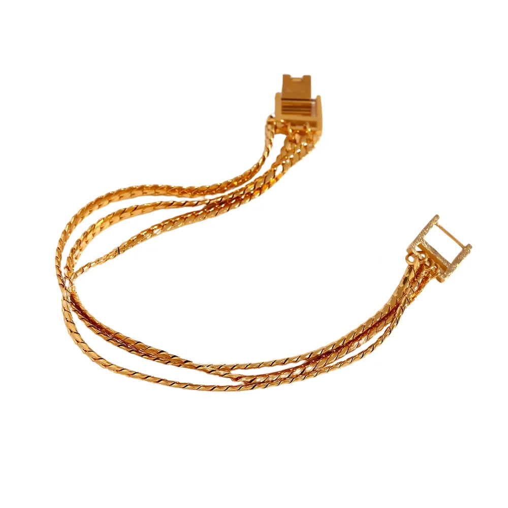 A gold stainless steel bracelet with a triple chain design, featuring a clasp closure.