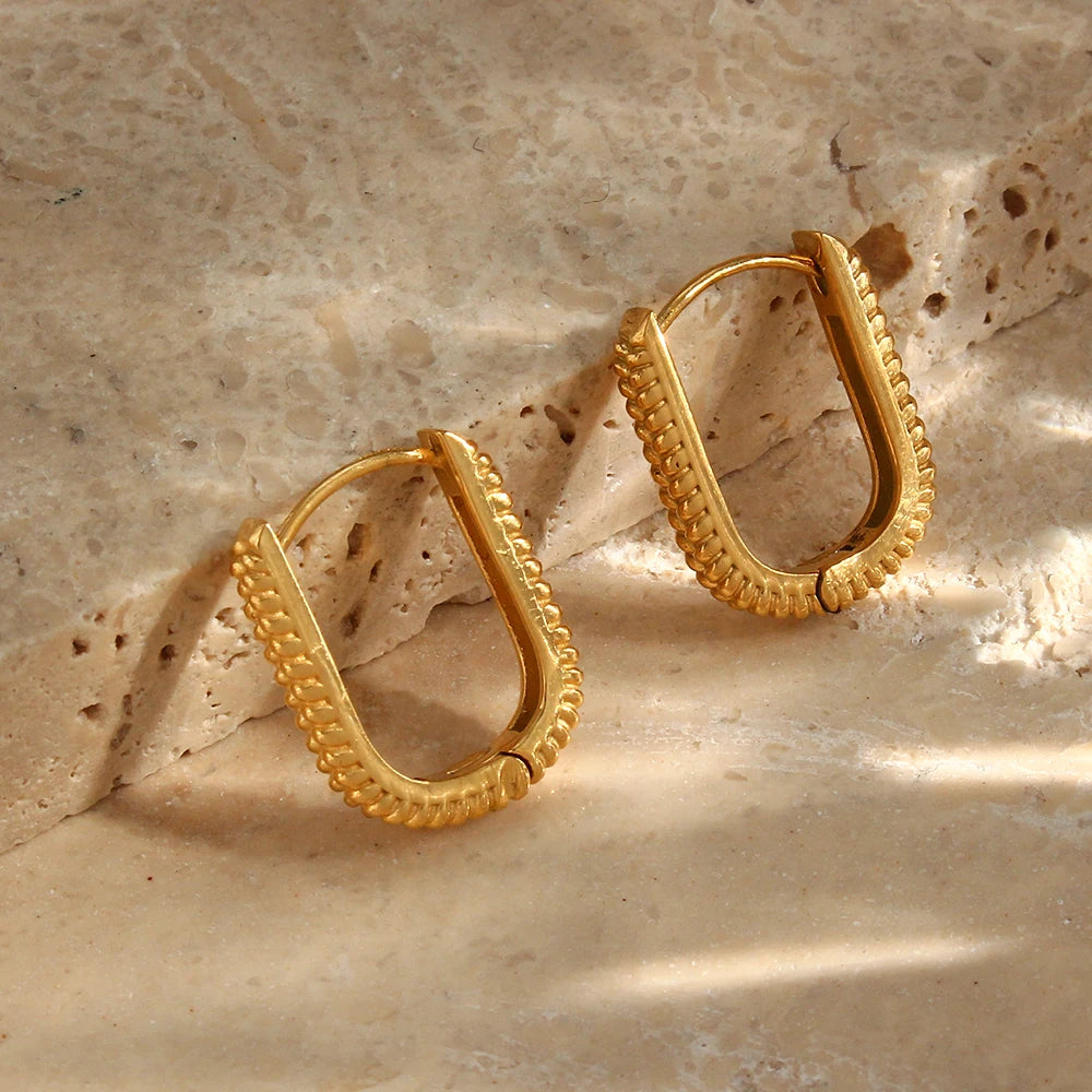 Terra Hoops Earrings gold on diplay