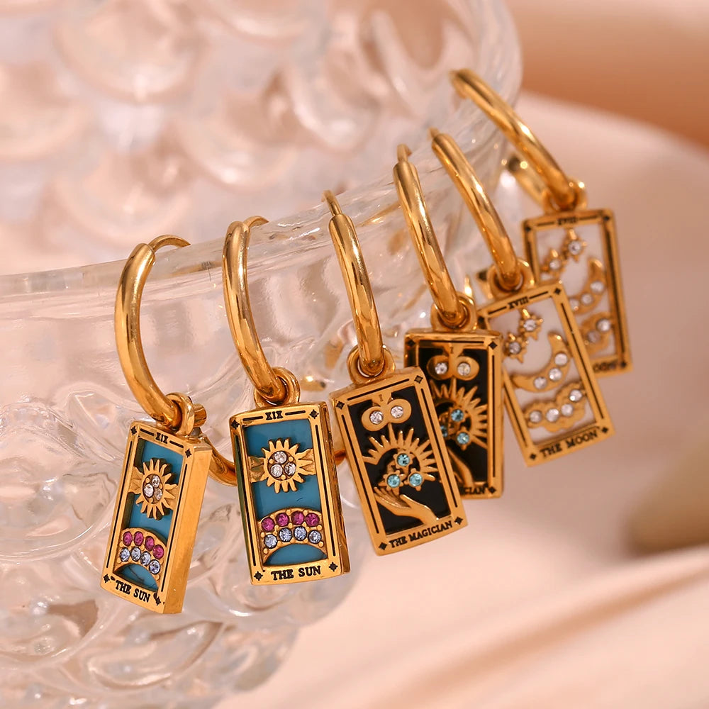 The Magician Tarot Card Earrings on glass display