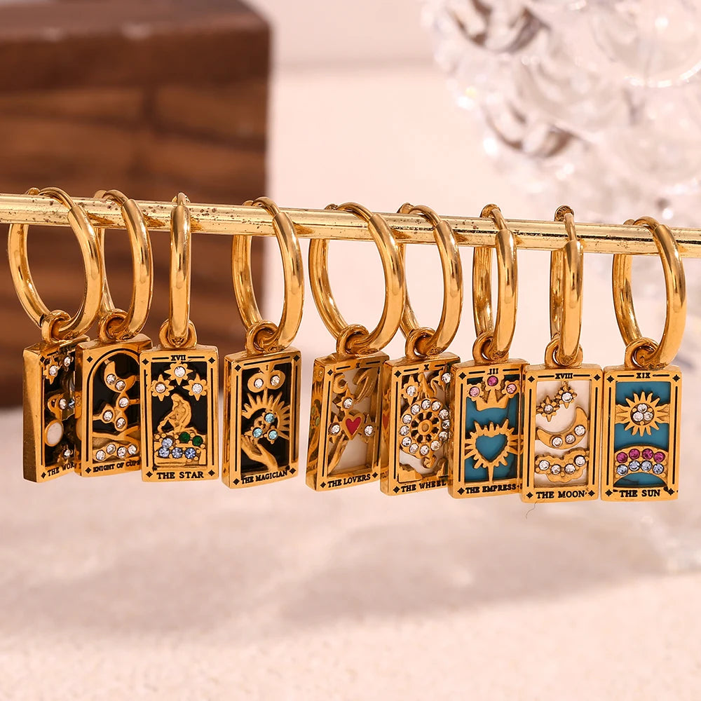 The Magician Tarot Card Earrings on display rack